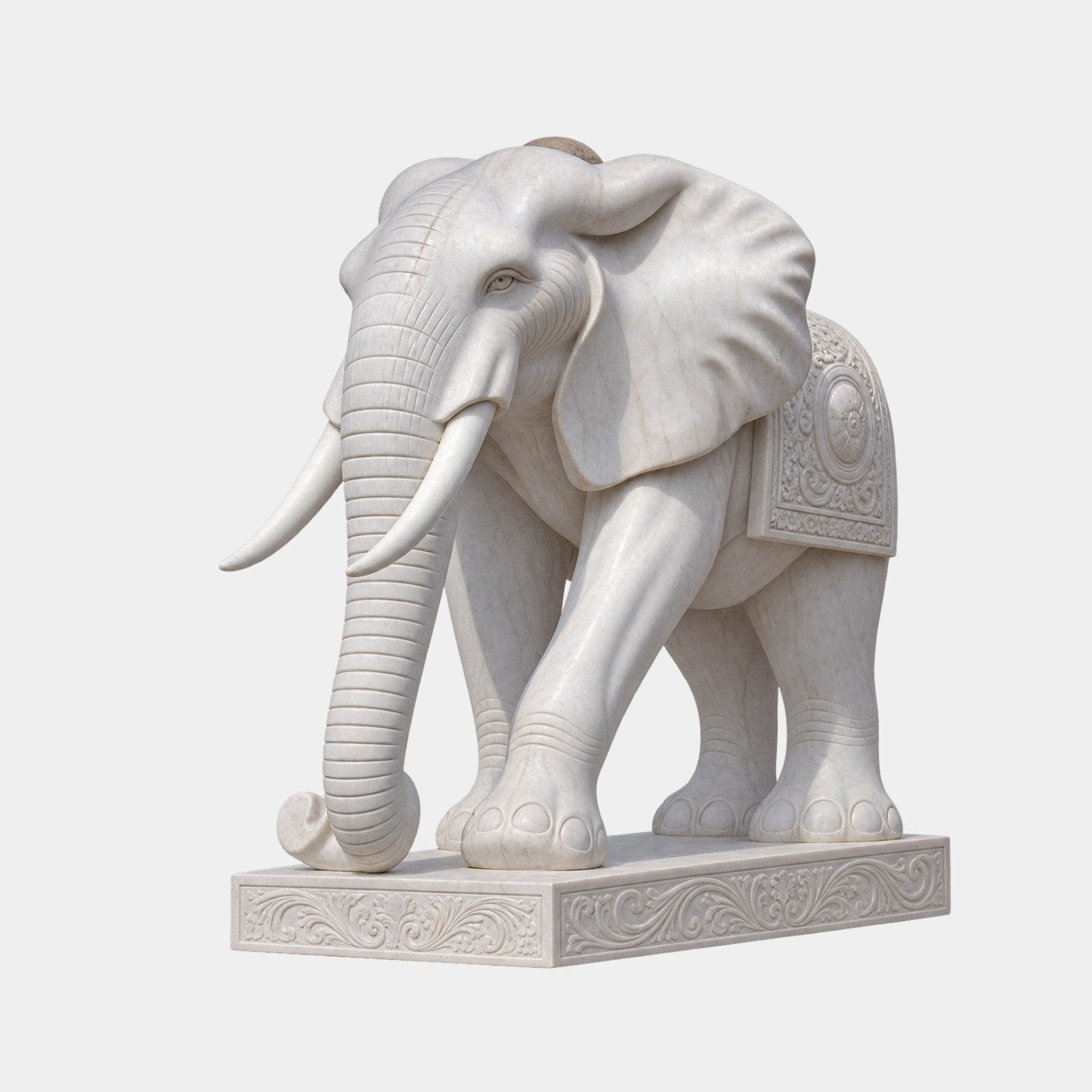 White marble elephant standing naturally on a low acanthus-carved slab
