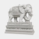 Grey granite caparisoned elephant on a tall banded pedestal