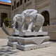 White marble caparisoned elephant on its carved pedestal