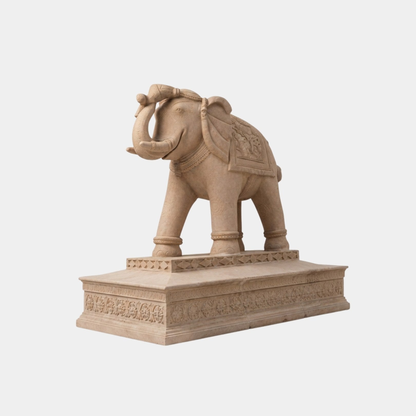 Pink sandstone Indian elephant with its trunk curled over its head