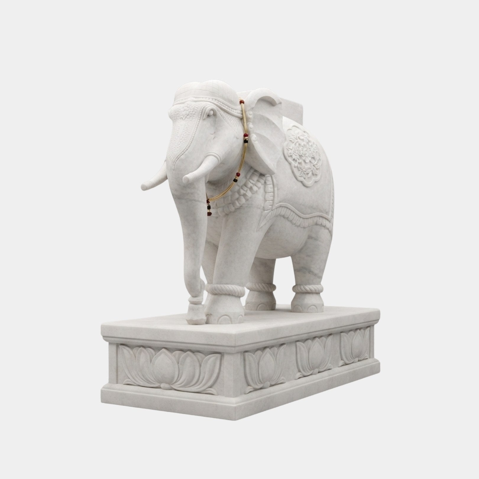 White marble elephant with a fine chain and beaded collar at the throat