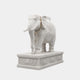 White marble elephant with a fine chain and beaded collar at the throat