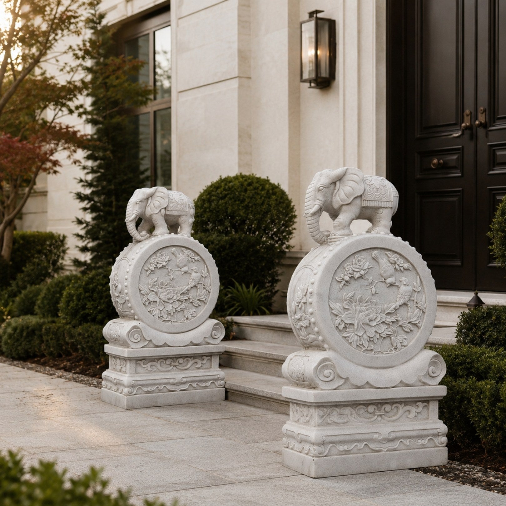 Marble gate drum stone carved with peonies and a bird, an elephant on top