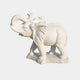 Small white marble elephant with its trunk curled back over its head
