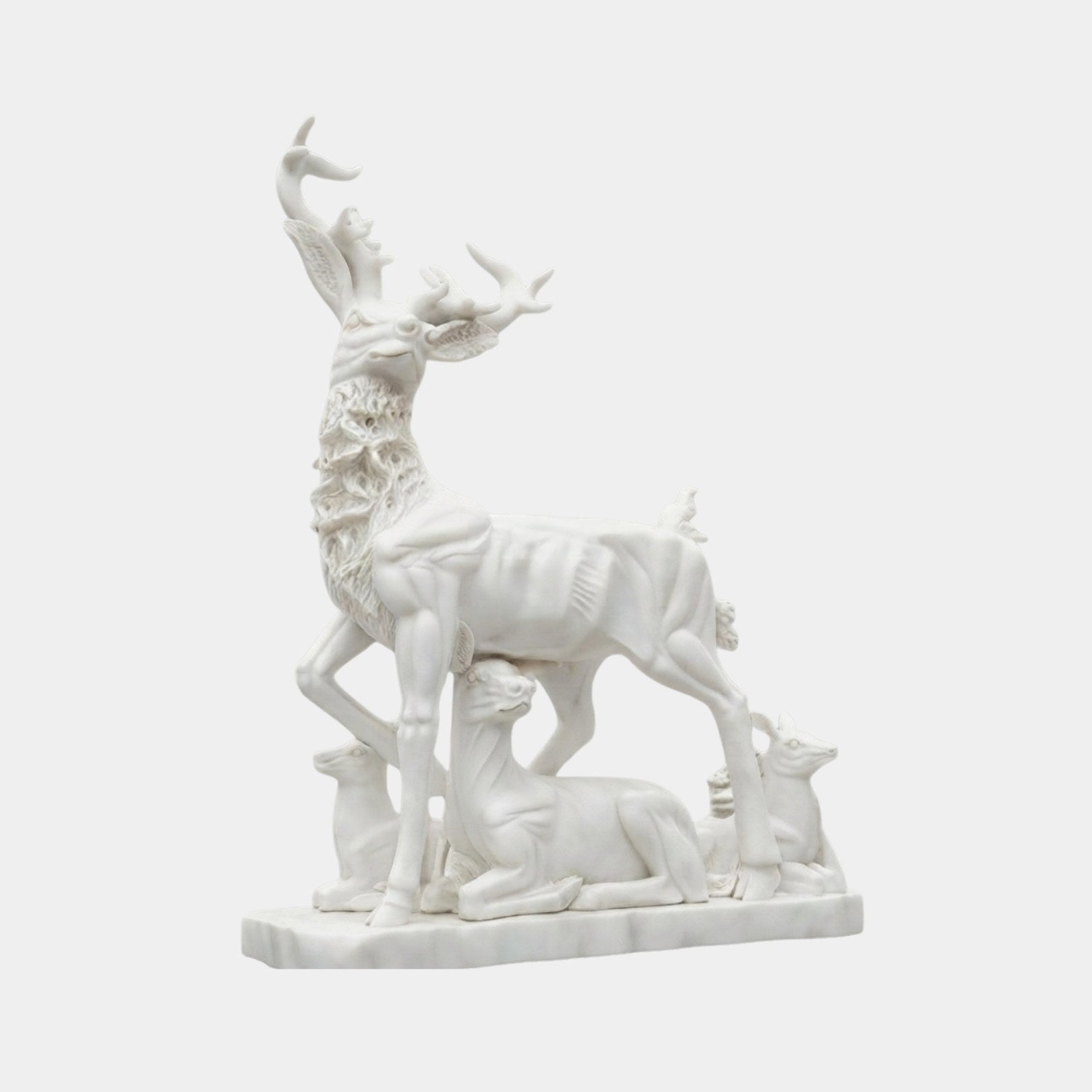White marble stag with three smaller deer grouped around it on one slab