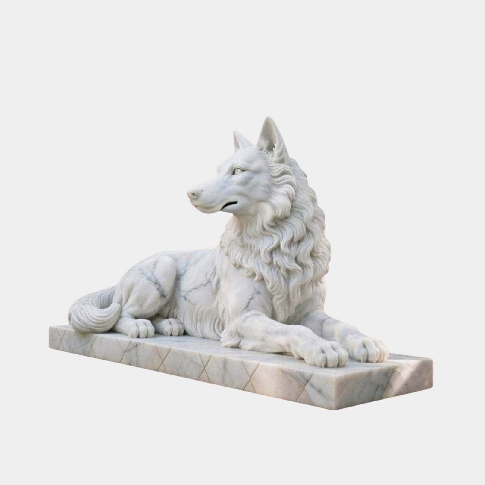 White marble wolf lying couchant with a heavy carved ruff and erect ears