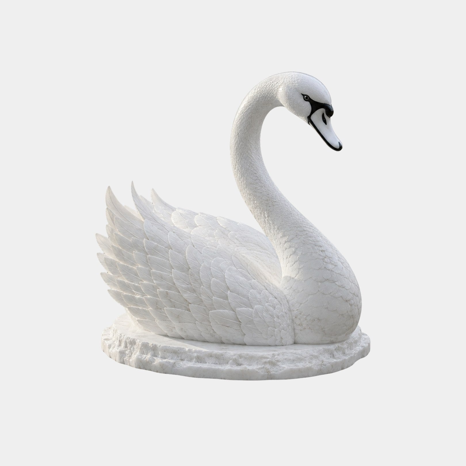 White marble swan at rest with wings folded high over its back