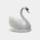 White marble swan at rest with wings folded high over its back