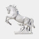 White marble horse leaping from a bank of carved cloud with forelegs raised