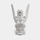 White marble winged lion seated with both forepaws resting on a carved shield