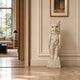 Beige marble owl shown indoors in a panelled hall