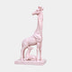 Pink marble giraffe standing with her calf lying between her legs