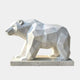 White marble bear cut into flat triangular planes, walking with head low