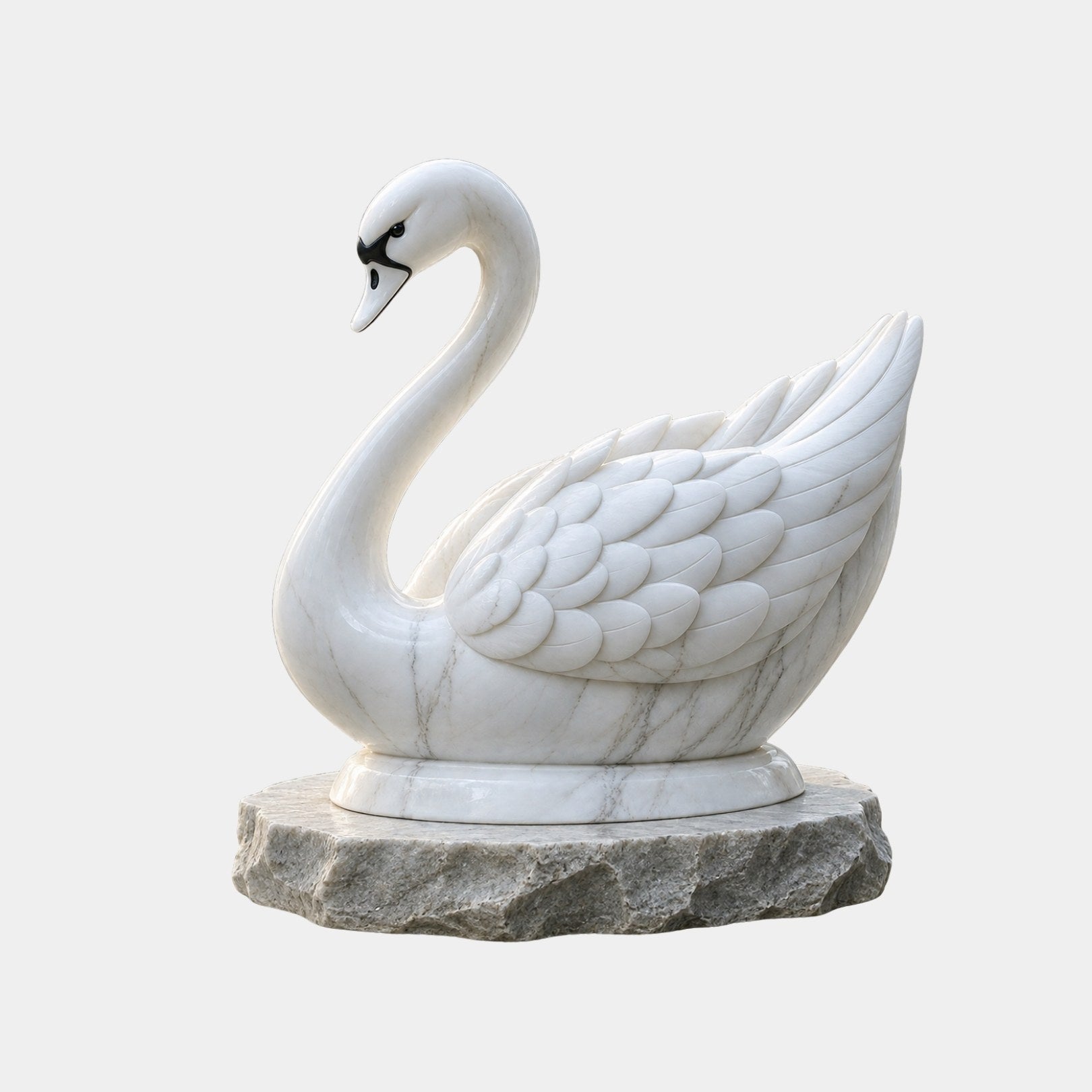 White marble swan at rest on a riven grey-buff marble base