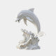 White marble dolphin springing from a carved breaking wave