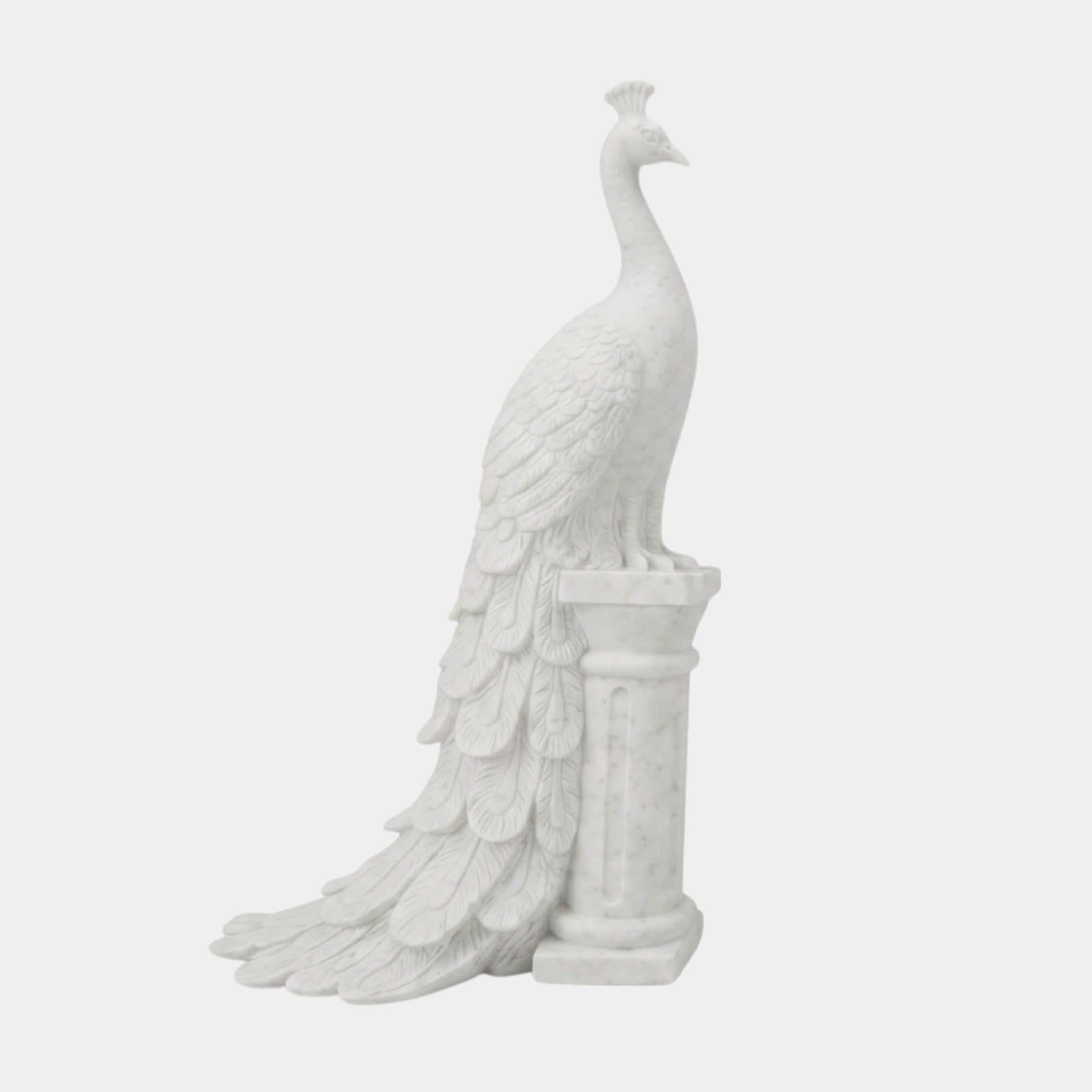 White marble peacock on a fluted column, tail carried down to the floor