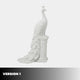 Version 1 of the marble peacock, standing on a low fluted column
