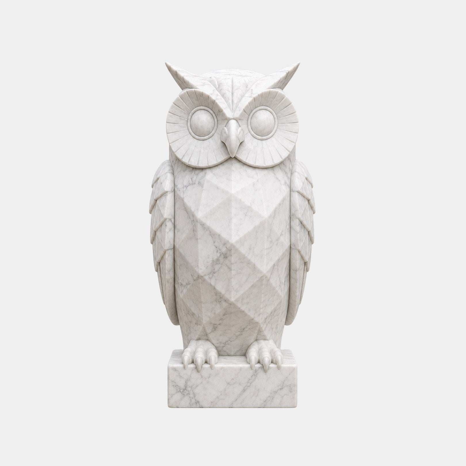 White marble owl with a faceted breast and radiating carved facial discs