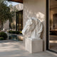 Small white marble horse head bust shown on a poolside terrace