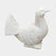 Small white marble dove in profile with its tail fanned and lifted