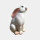 White marble rabbit sitting up with its long ears laid back
