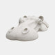 Two white marble hippopotamus heads breaking the surface together