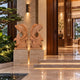 Two mirrored terracotta marble fish shown at a lit hotel entrance