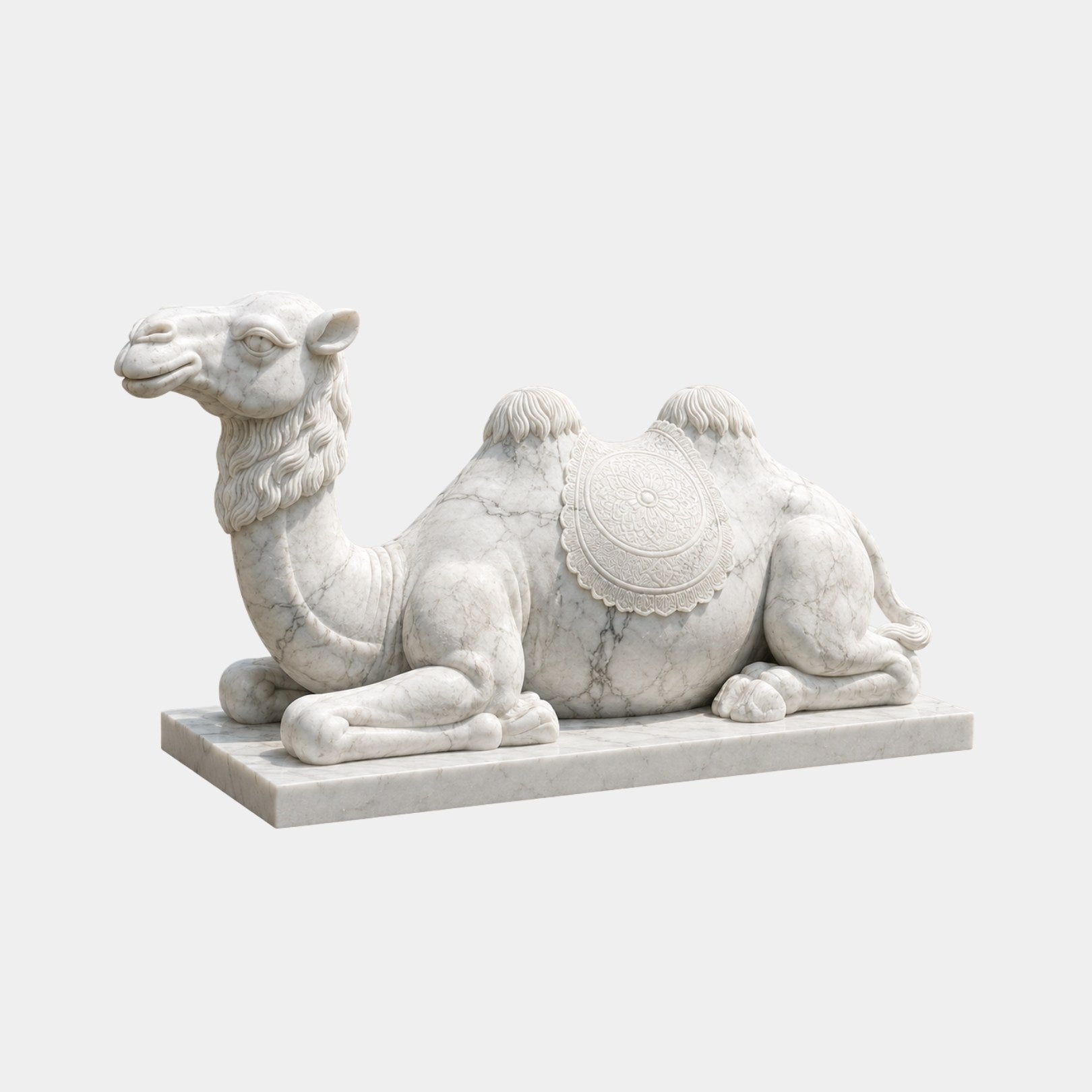 White marble Bactrian camel lying couchant with a carved saddle-cloth medallion