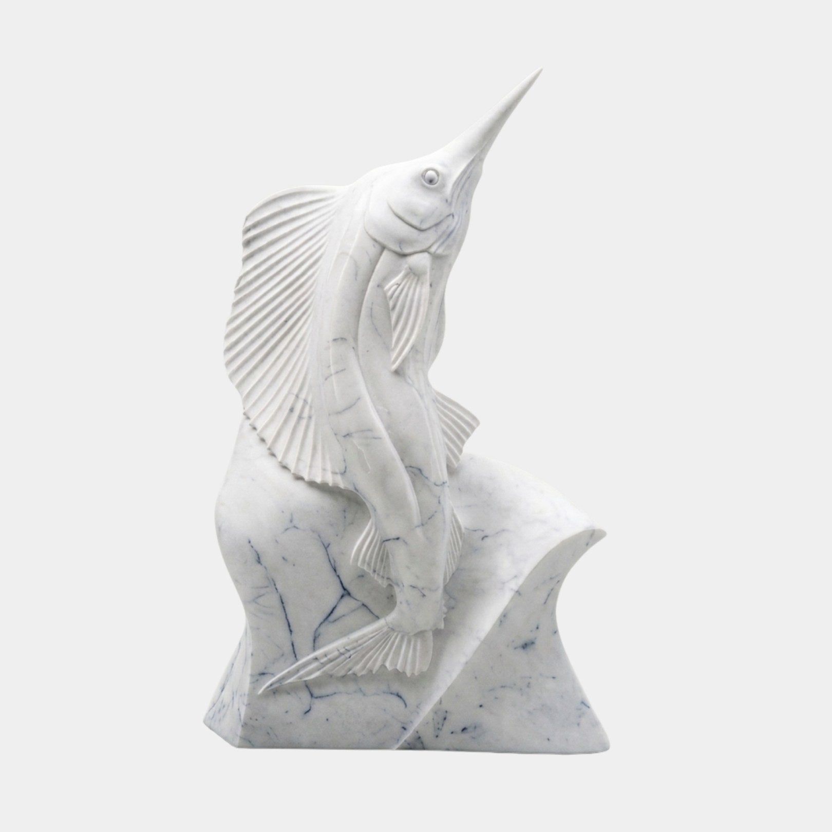 White marble sailfish rising from a wave with its sail dorsal fully fanned