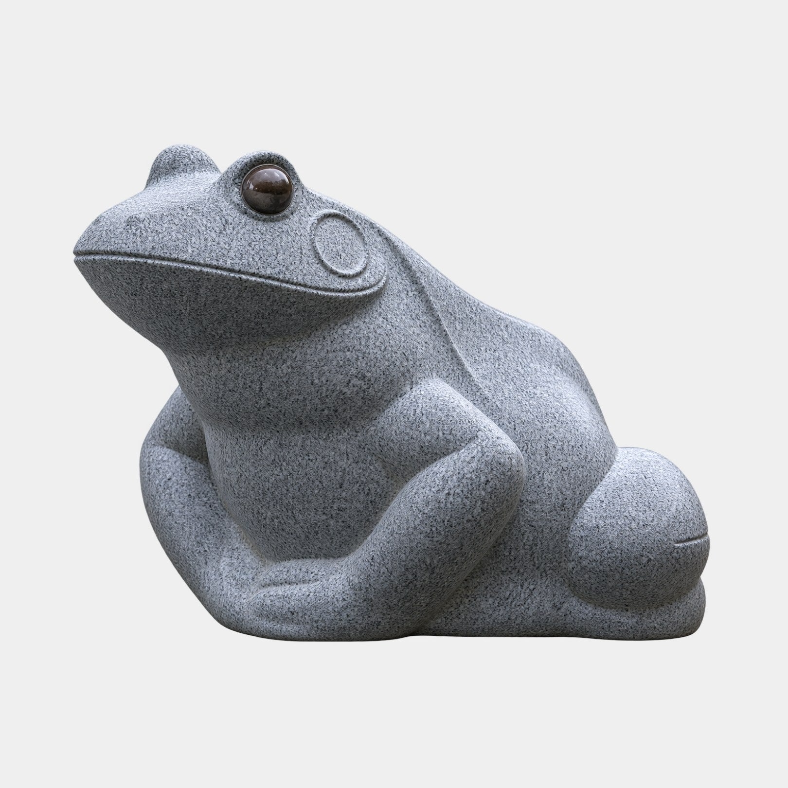 Grey granite frog sitting with its head raised and inset amber eyes