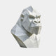 White marble gorilla head cut into flat planes with modelled eyes