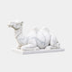 White marble Bactrian camel couchant and entirely plain, head turned back