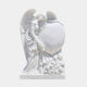 White marble angel resting against a large heart tablet with carved tulips, 170cm