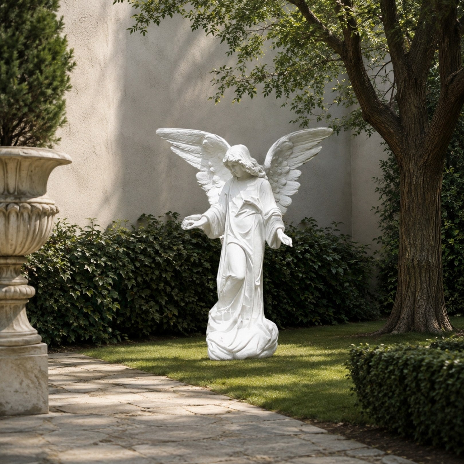 Marble standing angel garden statue shown in a walled garden