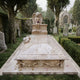 Marble chest tomb memorial shown in a churchyard with the angel at the head