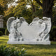 Marble double angel heart headstone shown square to a cemetery path
