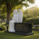 Marble angel and three panel granite memorial shown on a family grave