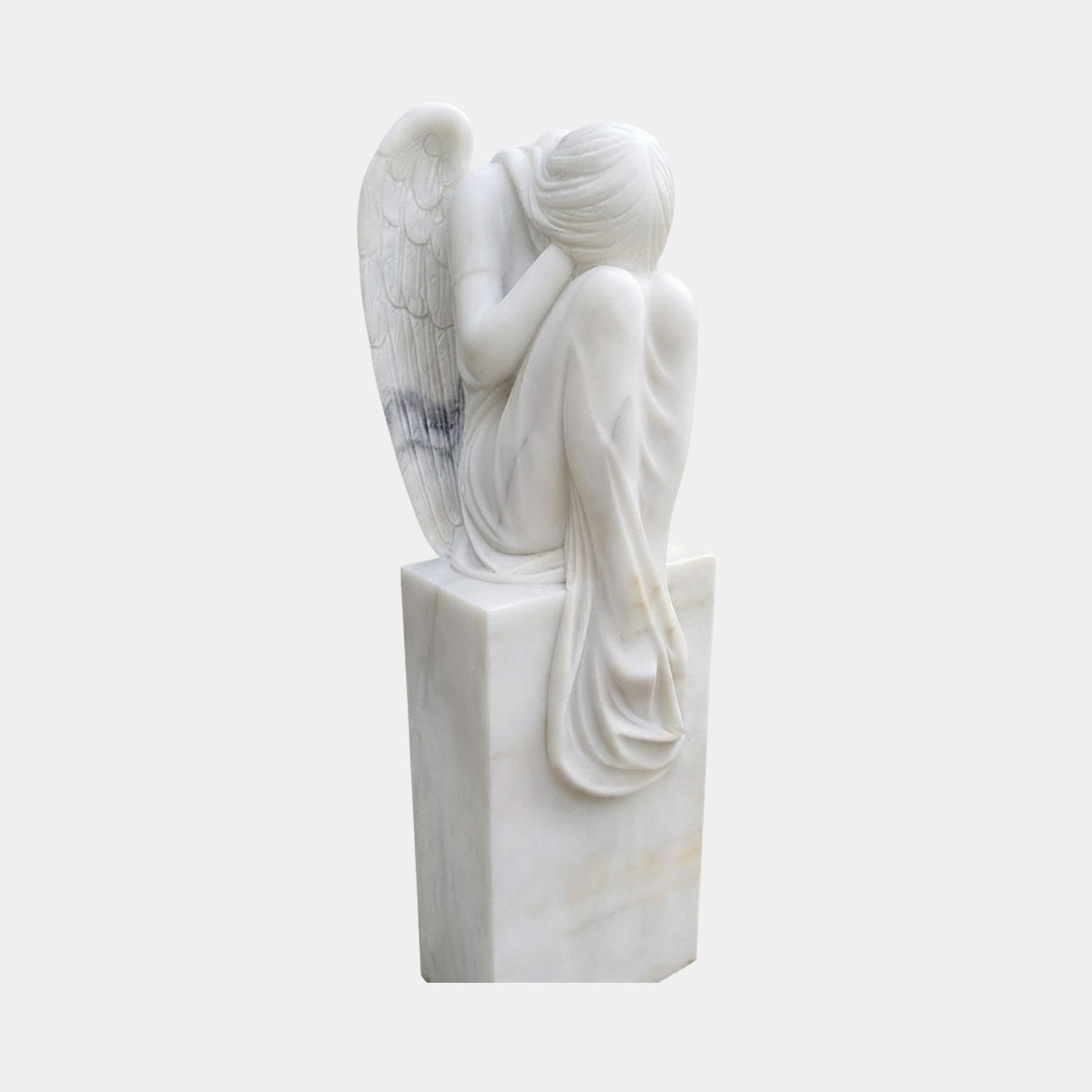 White marble grieving angel curled over her knees on a tall plain plinth, 130cm
