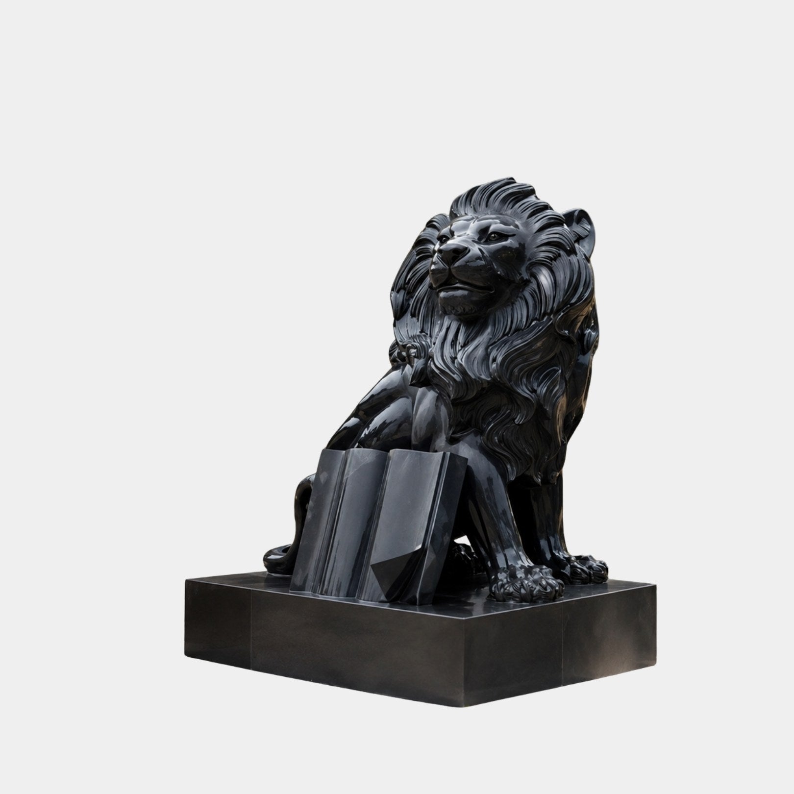 Mirror polished black granite seated lion with an open book at his forepaws, 150cm