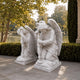 Mirrored pair of marble kneeling angels shown facing one another
