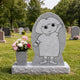 Grey granite engraved child headstone shown on a cemetery lawn
