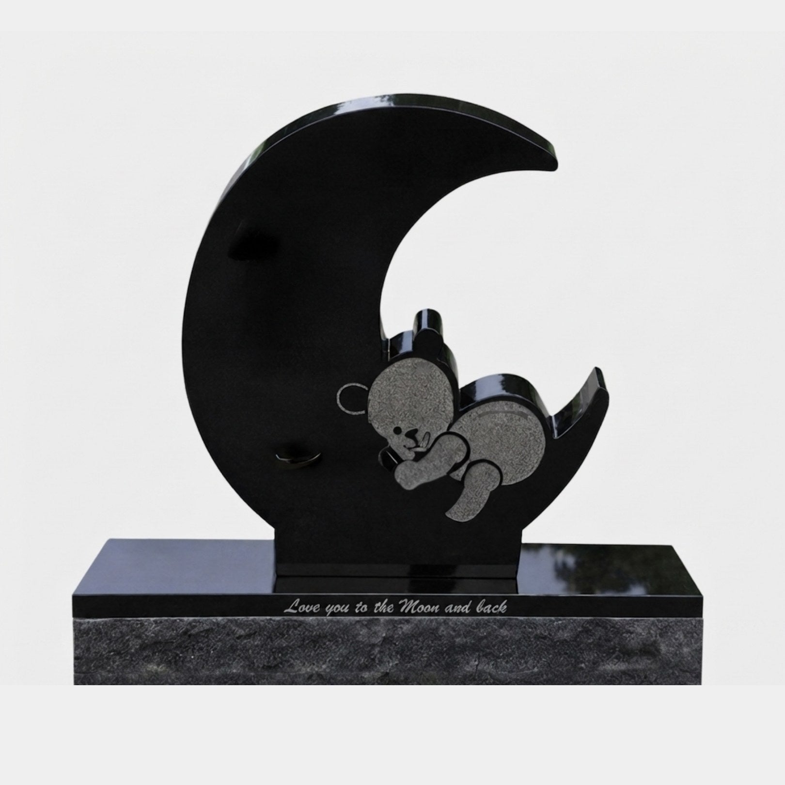 Polished black granite crescent moon with a matte sleeping bear on its horn, 110cm