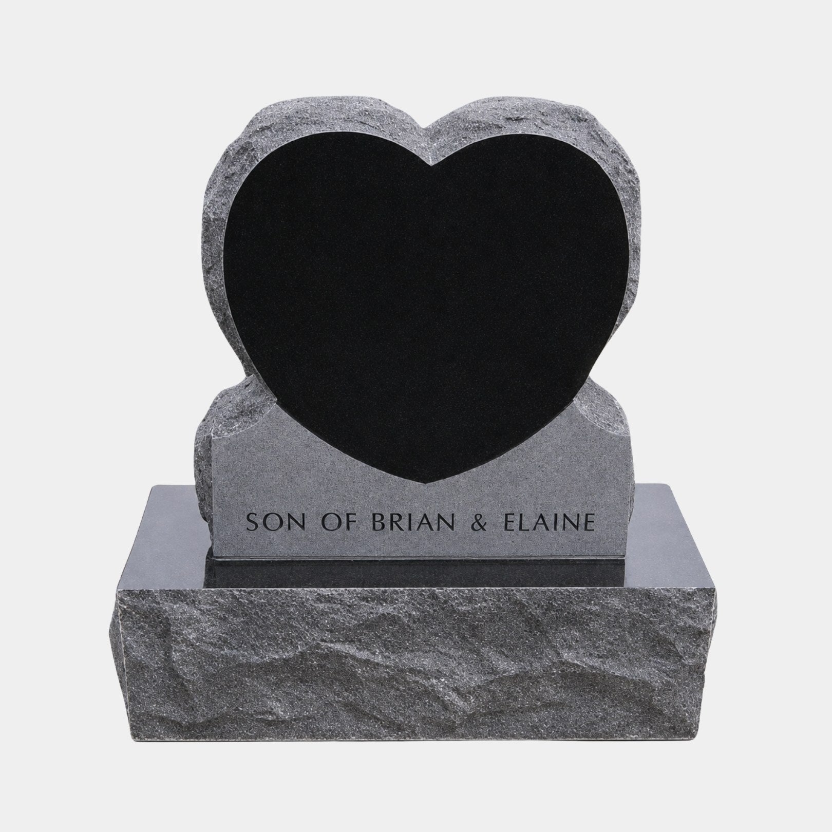 Mirror polished black heart set into a rock-pitched grey granite surround, 120cm