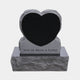 Mirror polished black heart set into a rock-pitched grey granite surround, 120cm