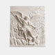 Marble relief of an archangel with a raised sword over a chained figure