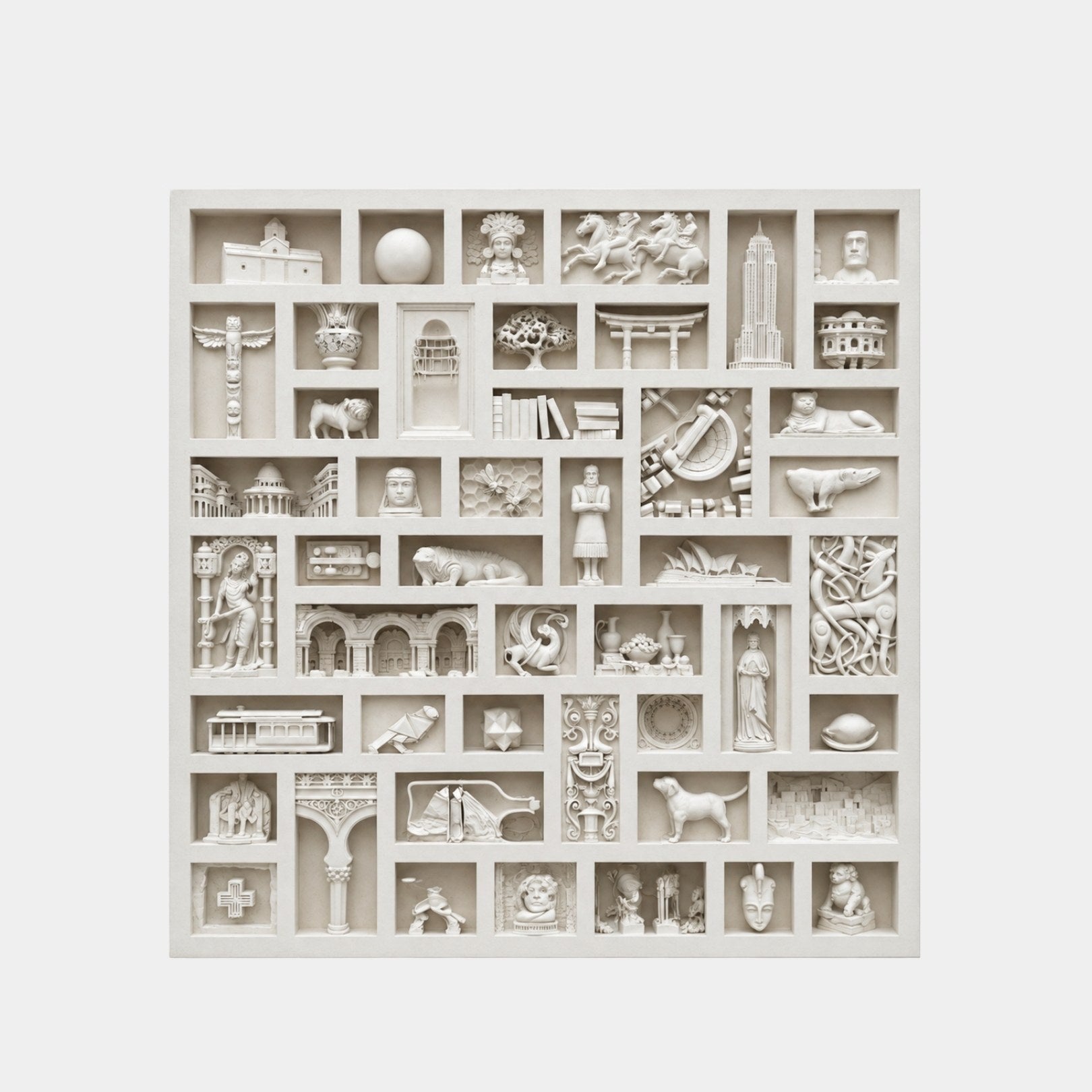 Marble relief panel of recessed compartments each holding a carved world icon