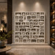 The world icons relief filling a lounge wall, lit from above