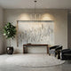 Four horse marble relief wall panel shown on an interior wall