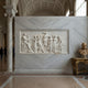 Apollo and muses marble relief frieze shown above an interior doorway