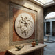 Marble relief roundel shown hung on an interior wall
